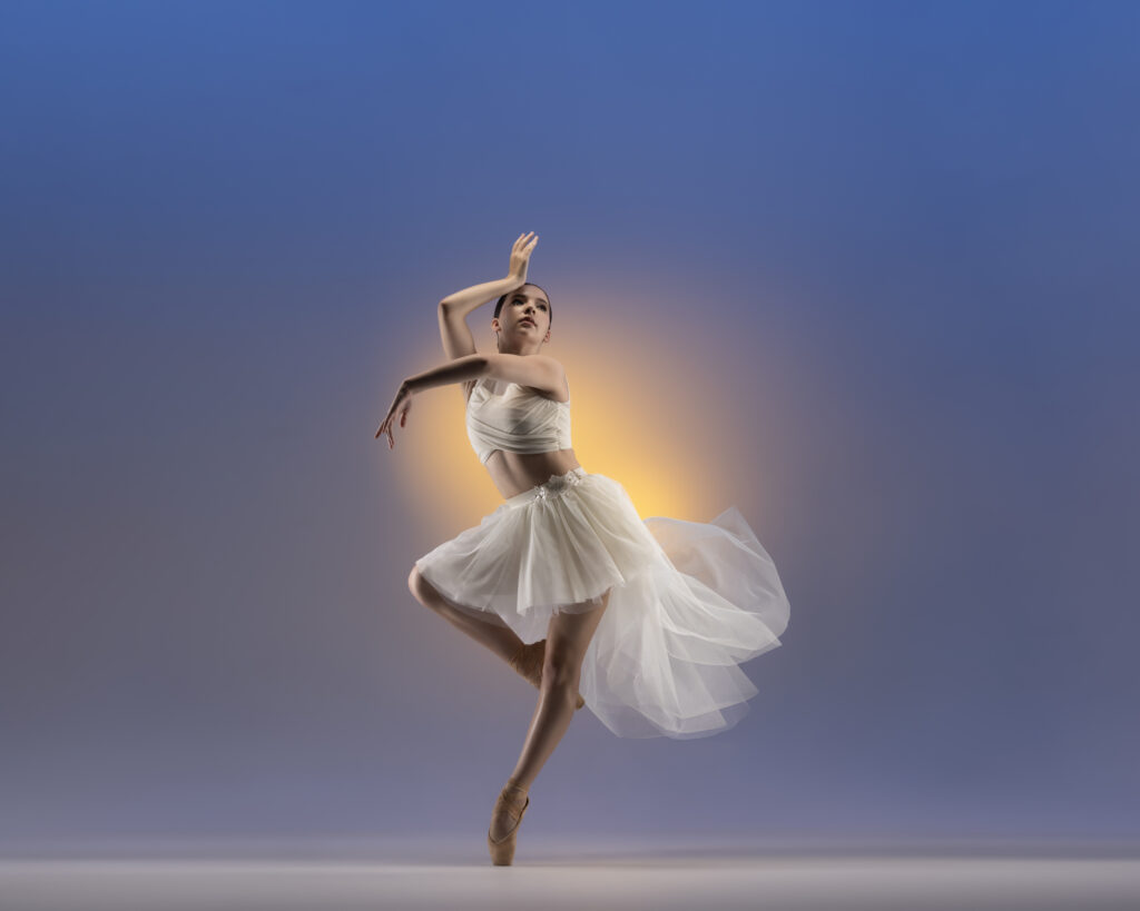 Ballet dancer on pointe in a white tutu, commercial dance photography by Ashkan Image, Houston