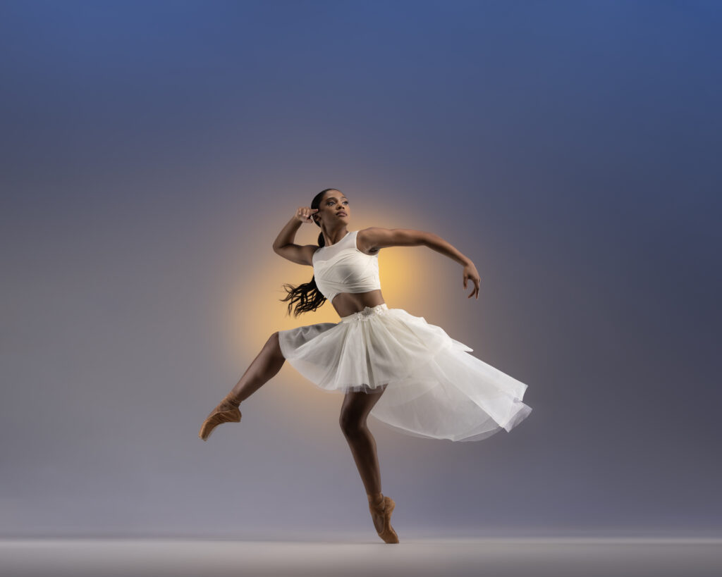 Ballet dancer in a white tutu mid turn, commercial dance photography by Ashkan Image in Houston