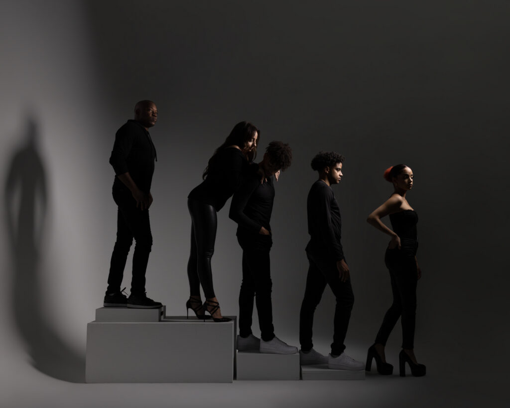 Creative family portrait in Houston, silhouetted family on studio steps
