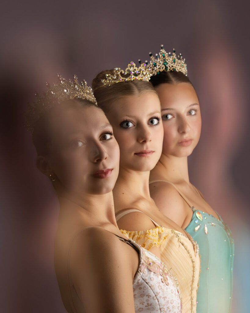 Close portrait of three ballet dancers in tiaras, company portraits by Ashkan Image