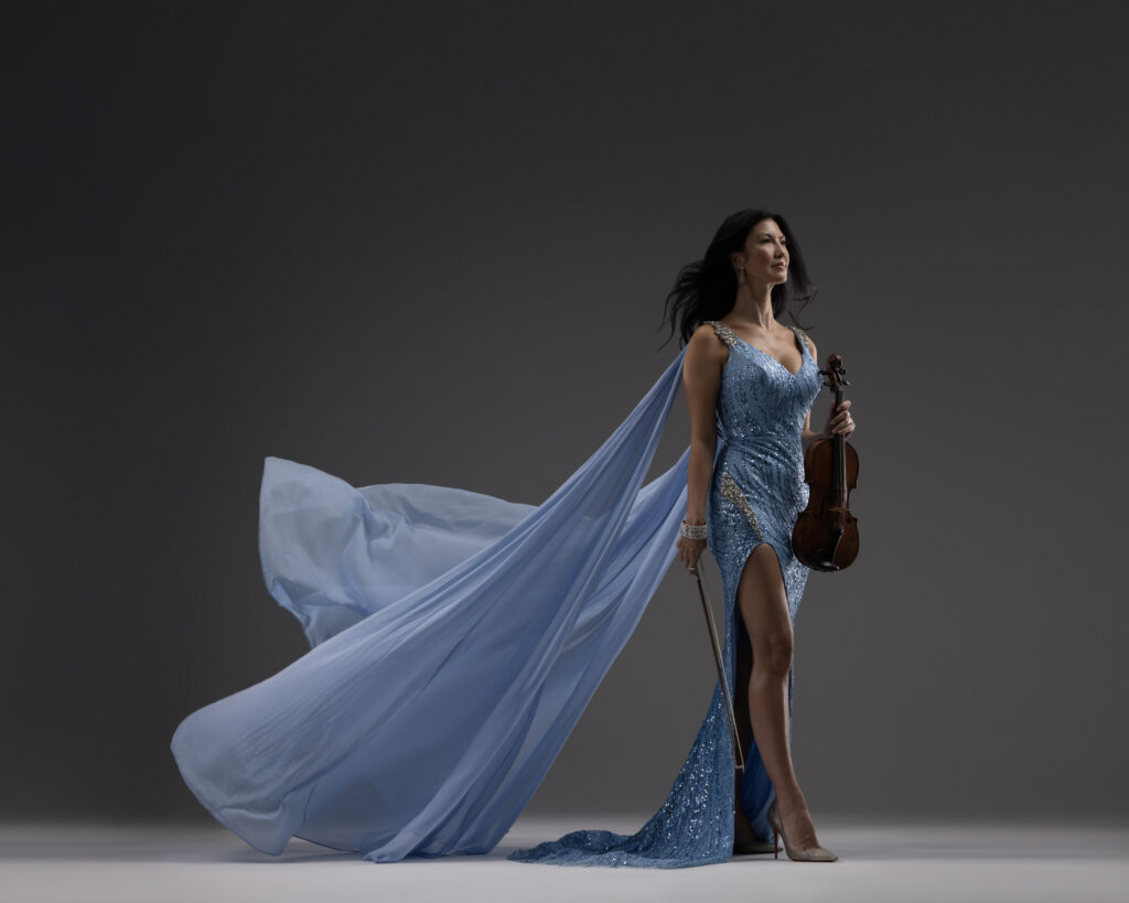 Personal branding photography in Houston, violinist in a blue sequin gown with a flowing cape, by Ashkan Image